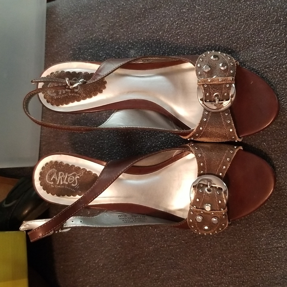 Carlos Santana women's size 9 1/2 brown heels with metal buckle and accents.